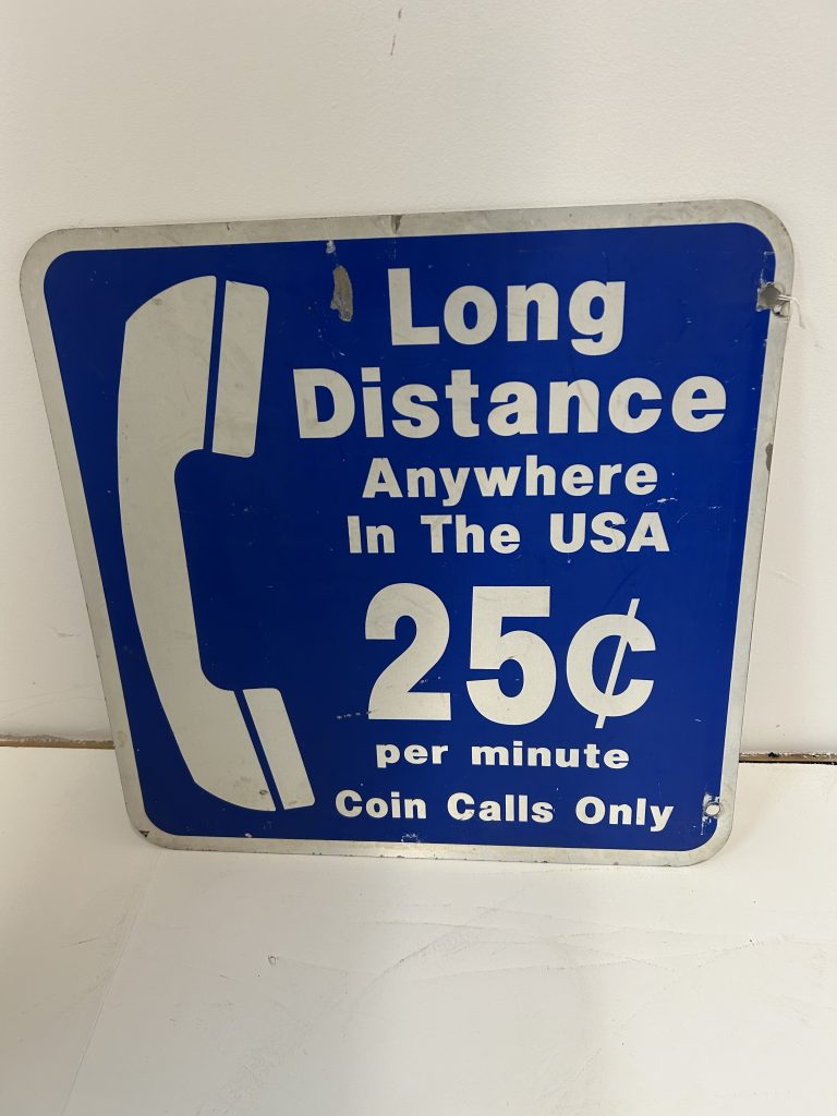 Long distance anywhere in the U.S.A. .25 per minute vintage sign